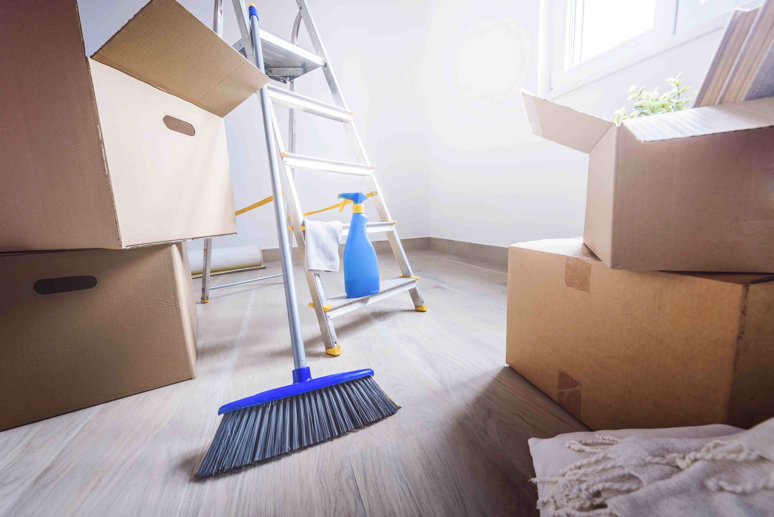 Empty,Room,Full,Of,Cardboard,Boxes,And,Cleaning,Things,For